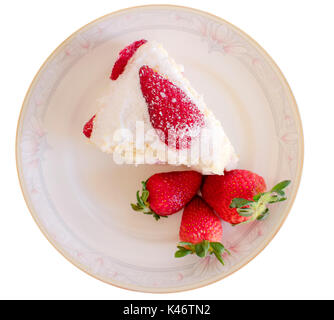 Strawberry cake and three strawberries with white top, top view, isolated on white background and on a porcelain plate Stock Photo