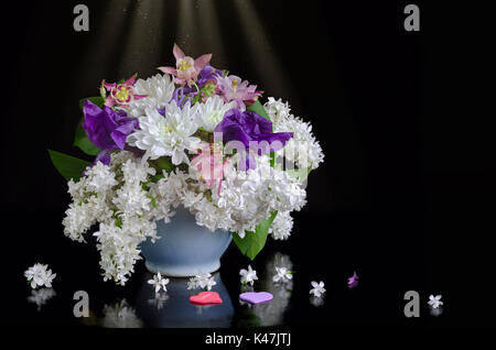 Flowers and hearts on a black background Stock Photo