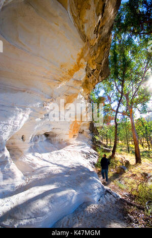 Sandstone wall with aboriginal art hand stencil Mt Moffatt National Park Stock Photo