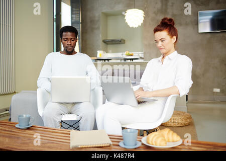Young Managers Wrapped up in Work Stock Photo