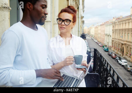 Coffee Break of Young Colleagues Stock Photo