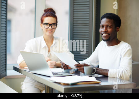 Financial Managers Wrapped up in Work Stock Photo
