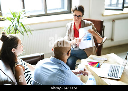 Presenting Creative Ideas to Colleagues Stock Photo