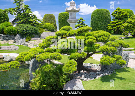 Beautiful garden in ecotourism designed in harmony with cypress, pine, stone, water and ancient trees bearing traditional culture of traditional Japan Stock Photo