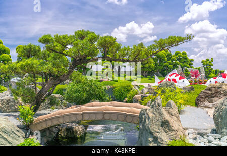 Beautiful garden in ecotourism designed in harmony with cypress, pine, stone, water and ancient trees bearing traditional culture of traditional Japan Stock Photo