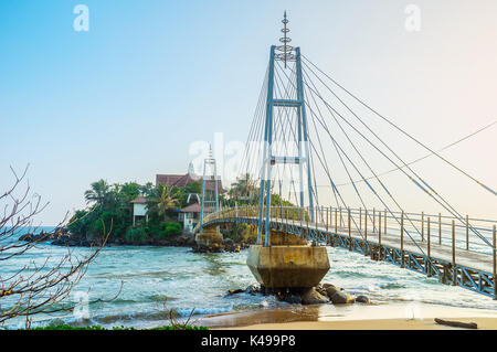 The view on beautiful footbridge to the Parey Dewa temple, located on Pigeon island, Matara, Sri Lanka Stock Photo