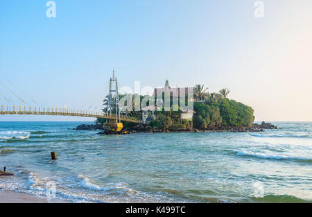 The view on scenic Parey Dewa buddhist temple on Pigeon island, that is the most notable landmark of city Matara, Sri Lanka Stock Photo