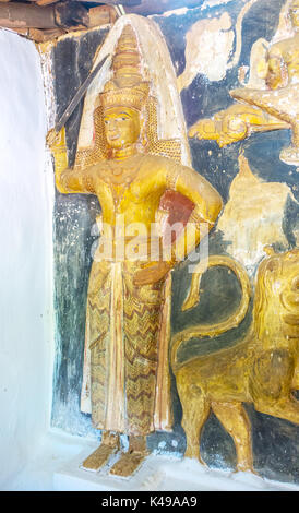 BATTALA, SRI LANKA - DECEMBER 2, 2016: The medieval statue of the temple guard at the entrance to image house of Yudaganawa temple, on December 2 in B Stock Photo
