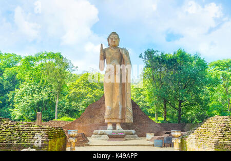 Maligawila Buddha statue is a holy place among locals and a popular tourist attraction in Sri Lanka Stock Photo