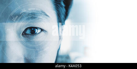 Panoramic close-up Asian businessman's eye , with futuristic technology visual effect, with white copy space Stock Photo