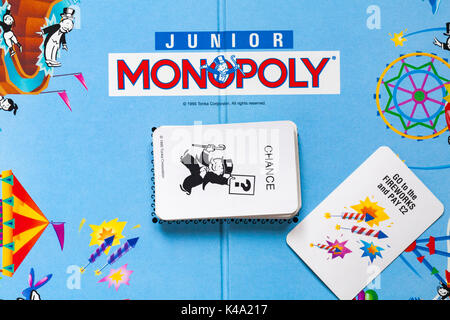 Junior Monopoly game - monopoly board with pile of chance cards - details looking down on Stock Photo