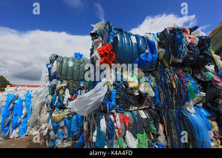 Bales with plastic foils for the plastic recycling in a recycling company, Ballen mit Plastikfolien fuer das Kunststoffrecycling in einem Recyclingbet Stock Photo
