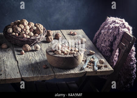 Fresh various nuts with on rustic wooden table Stock Photo