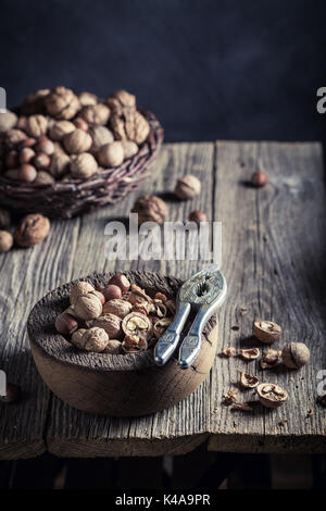 Healthy various nuts with on rustic wooden table Stock Photo
