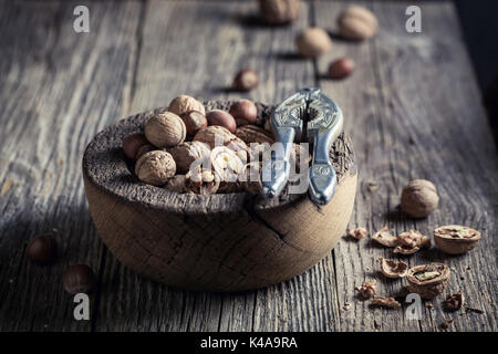 Delicious various nuts with on rustic wooden table Stock Photo