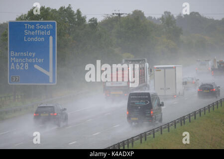 Heavy rain hits morning commuters on the M1 Motorway at Barnsley, South Yorkshire, UK. Stock Photo