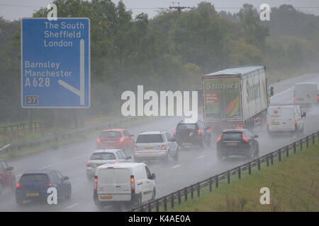 Heavy rain hits morning commuters on the M1 Motorway at Barnsley, South Yorkshire, UK. Stock Photo