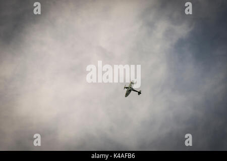 Supermarine Spitfire World War II fighter plane over Folkestone, Kent, UK Stock Photo