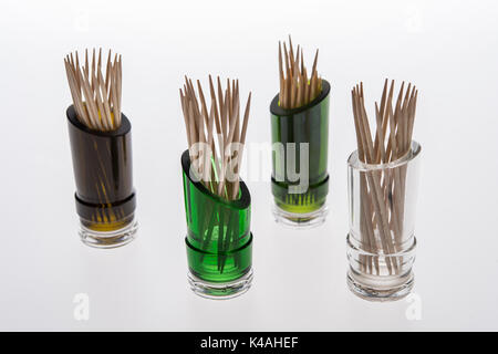 Bottles recycled, cut open wine bottles, bottles of different colors, decorated with wooden picks, Germany Stock Photo