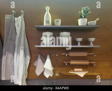 Kitchen utensils on shelf and wall, nice interior wooden design Stock Photo