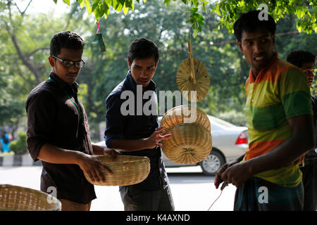 A traditional bamboo made handicrafts shop on April 13, 2016 in Dhaka, Bangladesh. Traditional baskets, rice winnowers, hand fans, tea trays, boxes an Stock Photo