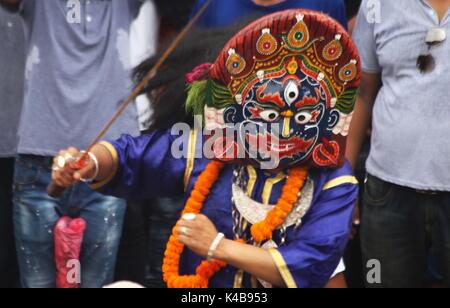 Kathmandu, Nepal. 5th Sep, 2017. Masked dancer 'Sawabhaku' performs in celebration of Indra Jatra Festival at Hanumandhoka Durbar Square in Kathmandu, Nepal, Sept. 5, 2017. The eight-day festival celebrates Indra, the god of rain, to mark the end of the monsoon. Credit: Sunil Sharma/Xinhua/Alamy Live News Stock Photo