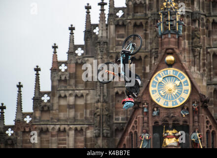 Nuremberg, Germany. 2nd Sep, 2017. Canadian mountainbiker Brett Rheeder performs a backflip at the 'Red Bull District Ride' on the Hauptmarkt square in Nuremberg, Germany, 2 September 2017. During the competition, the riders present their skills with jumps and tricks in a parcours leading through the old town. The District Ride has taken place in 2005, 2006, 2011 and 2014 in Nuremberg. Photo: Silas Stein/dpa/Alamy Live News Stock Photo