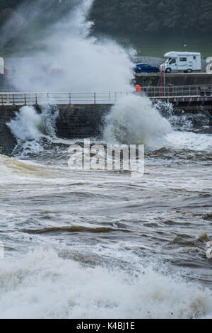 Aberystwyth Wales UK, Wednesday 06 September 2017 UK Weather: As the weather again turns unsettled and breezy, strong winds and high tides bring stormy waves crashing into the harbour wall in Aberystwyth on the Cardigan Bay coast of West Wales photo Credit: Keith Morris/Alamy Live News Stock Photo