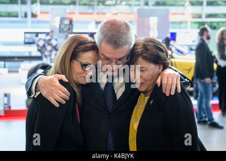 dpatop - IOC president Thomas Bach puts his arms around Ilana Romano (L), the widow of the Israeli heavyweight lifter Josef Romano, and Anke Spitzer, the widow of the Israeli fencer Andre Spitzer, at the unveiling of a memorial in honour of the victims of the 1972 Munich Summer Olympics massacre in Munich, Germany, 6 September 2017. Both men were murdered by the Palestinian terrorist organisation Black September. The organisation took the Israeli athletes hostage in an attempt to free 234 Palestinian prisoners held by Israeli authorities as well as several members of the German Red Army Fracti Stock Photo