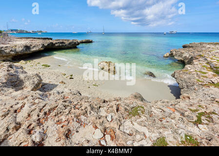 Rocky coastline in Cayman Islands with clear turquoise water. Stock Photo
