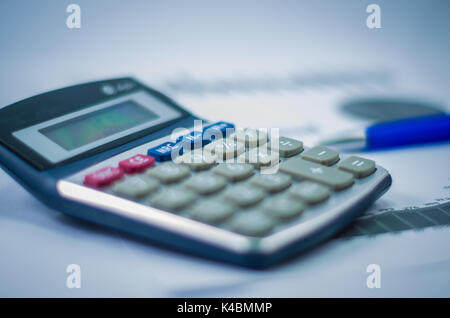 Pen, graphs, calculator, finance concept, home economics. Stock Photo