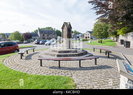 The old village water pump at Hartington village in the Derbyshire Peak District, England, UK Stock Photo