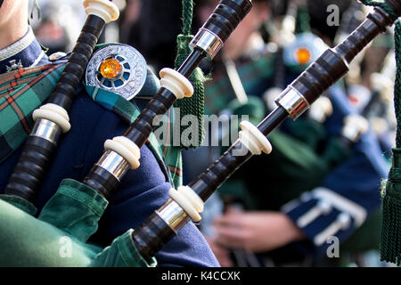 Close up of bagpipe players playing in a pipe band during a Scottish Highland Games event Stock Photo