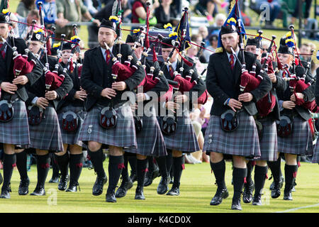 Pipe band playing during a Scottish Highland Games event Stock Photo