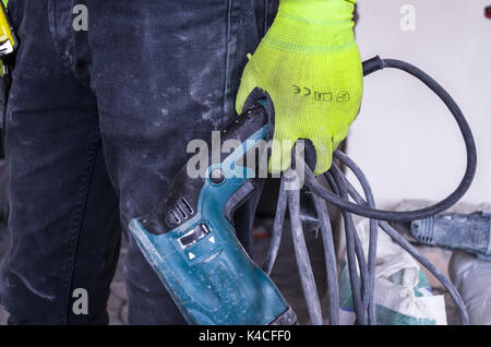 A worker and a drill Stock Photo