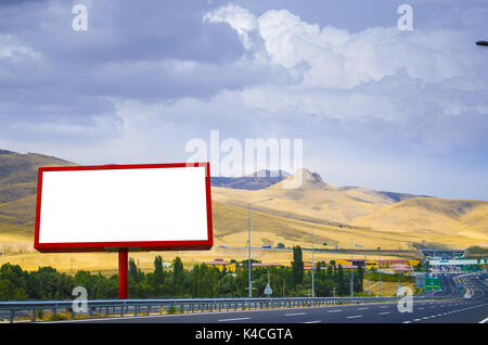 Blank white billboard on the background of the highway Stock Photo
