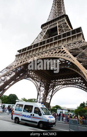 Police Patrol Car In Front Of The Eiffel Tower Stock Photo