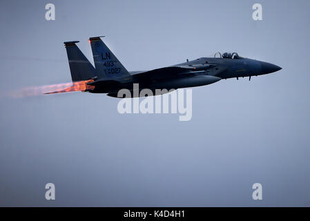 An alert ready F-15C Eagle from the 493rd Expeditionary Fighter Squadron respond to an alert scramble notification. Stock Photo