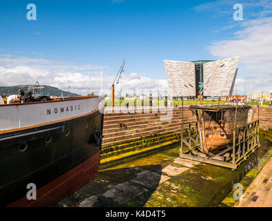 Bow of SS Nomadic with Titanic Belfast in background Stock Photo