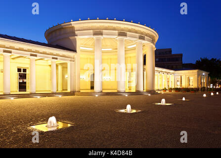 The famous Elisenbrunnen in Aachen, Germany. Illuminated with night blue sky. Stock Photo