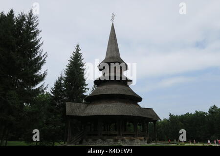 Impressive buildings in surroundings of famous Peri monastery, the tallest wooden structure in the world, Sapanta, Romania. Stock Photo