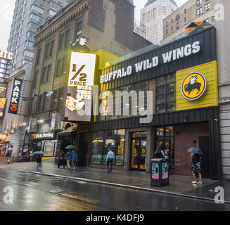 The Times Square branch of the Buffalo Wild Wings restaurant chain in New York on Tuesday, August 29, 2017. Shares of the fast casual chain have dropped 15.8% since its bleak earnings report a month ago. (© Richard B. Levine) Stock Photo