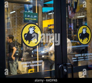 The Times Square branch of the Buffalo Wild Wings restaurant chain in New York on Tuesday, August 29, 2017. Shares of the fast casual chain have dropped 15.8% since its bleak earnings report a month ago. (© Richard B. Levine) Stock Photo