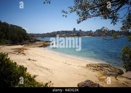 small sailing boat on a beach in the Sydney bay, Australia Stock Photo