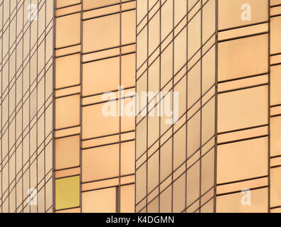 Reflective gold glass facade on modern building Stock Photo