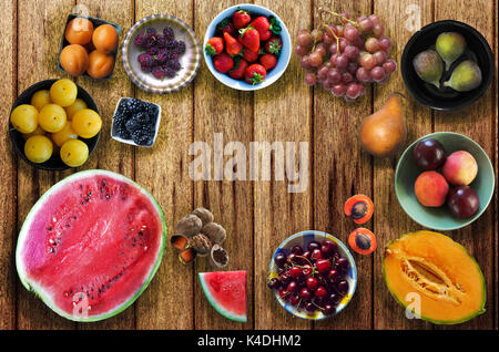 Summer fruits on wooden table Stock Photo