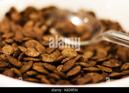 Chocolate flakes with spoon for breakfast. Selective focus. Stock Photo