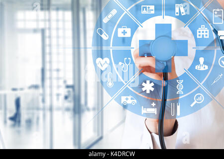 Health care and medical services concept with circular AR interface and female doctor using stethoscope Stock Photo