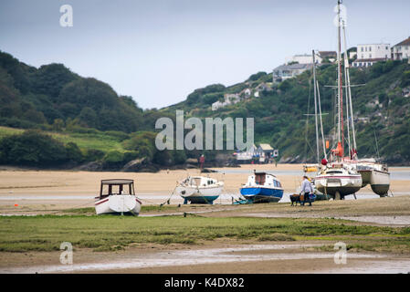Gannel estuary - Various boats moored on the Gannel River at low tide. Stock Photo