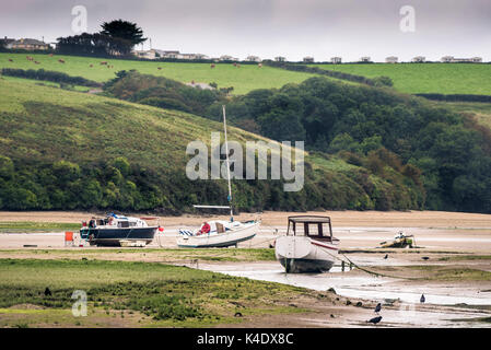 Various boats moored on the Gannel River at low tide. Stock Photo